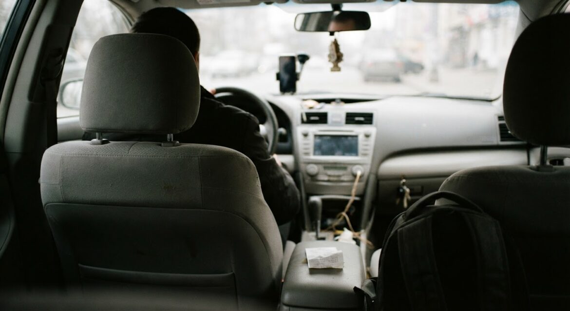 the interior of a car showing both front seats from the back seat perspective